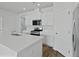 Modern kitchen with white cabinetry, an island, stainless steel appliances, and wood-look flooring at 293 Blue Haw Dr, Moncks Corner, SC 29461