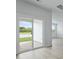 View from the interior to the patio with sliding glass doors and backyard view at 293 Blue Haw Dr, Moncks Corner, SC 29461