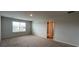 Spacious bedroom featuring plush carpet and a bright window at 295 Blue Haw Dr, Moncks Corner, SC 29461