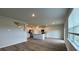 Open concept kitchen with white cabinets, stainless steel appliances, and an island at 295 Blue Haw Dr, Moncks Corner, SC 29461