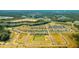 New construction aerial view of an expansive residential community near a lake at 297 Blue Haw Dr, Moncks Corner, SC 29461