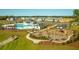 Aerial shot of a community featuring a pool, playground, ample parking, and green spaces at 297 Blue Haw Dr, Moncks Corner, SC 29461