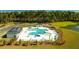 Resort-style pool with sundeck, lounge chairs, palm trees, and umbrellas for a relaxing experience at 297 Blue Haw Dr, Moncks Corner, SC 29461