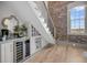 Wet bar area with under-stair wine rack and accent lighting at 3 Queen St # 315, Charleston, SC 29401
