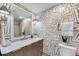 Stylish bathroom showcasing unique wallpaper, a marble countertop, and gold accents at 3 Queen St # 315, Charleston, SC 29401