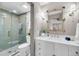 Bathroom featuring shower with glass door, decorative mirror and vanity at 3 Queen St # 315, Charleston, SC 29401