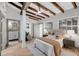 Cozy bedroom highlighting exposed beams, and an ensuite bathroom at 3 Queen St # 315, Charleston, SC 29401