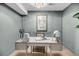 Home office with built in desk, decorative wall trim and stylish decor at 3 Queen St # 315, Charleston, SC 29401