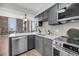 Stylish kitchen features a sleek design, modern appliances, and an open layout with brick accents at 3 Queen St # 315, Charleston, SC 29401