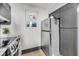 Modern kitchen featuring marble countertops, stainless steel appliances, and sleek gray cabinetry at 3 Queen St # 315, Charleston, SC 29401