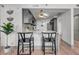 Contemporary kitchen featuring a marble countertop and seating at the bar at 3 Queen St # 315, Charleston, SC 29401