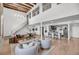 Bright and airy living room featuring an open floor plan, modern furnishings, and wood beam accents at 3 Queen St # 315, Charleston, SC 29401