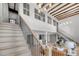 Bright living space featuring stairs, exposed beams, high ceilings, and neutral decor at 3 Queen St # 315, Charleston, SC 29401