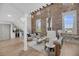 Open concept living area with brick wall, hardwood floors, wine storage, and elegant decor at 3 Queen St # 315, Charleston, SC 29401