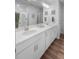 Elegant bathroom featuring double sinks, a large mirror, and stylish fixtures at 307 Lanyard St, Johns Island, SC 29455