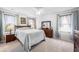 Spacious bedroom with carpet flooring, ceiling fan, and a large window for natural light at 307 Lanyard St, Johns Island, SC 29455
