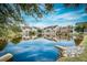 View of beautiful pond surrounded by lush trees and townhome buildings at 307 Lanyard St, Johns Island, SC 29455