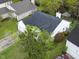 Bird's eye view of a residence with a lush lawn, dark roof, and convenient garage at 308 Burton Ave, Summerville, SC 29485