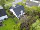 Aerial view of a house featuring a patio, dark roof, and well-maintained yard at 308 Burton Ave, Summerville, SC 29485