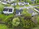 Aerial view of home featuring a dark roof, patio, and beautiful landscaping in a serene setting at 308 Burton Ave, Summerville, SC 29485