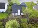 Aerial view of home with patio surrounded by trees and shrubs at 308 Burton Ave, Summerville, SC 29485