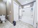 Bathroom featuring tiled floors, toilet, and a shower over tub at 308 Burton Ave, Summerville, SC 29485