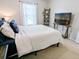 Bright bedroom featuring a cozy bed, natural light, and stylish decor, creating a relaxing and inviting atmosphere at 308 Burton Ave, Summerville, SC 29485