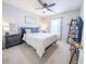Bedroom features a queen bed, carpet, natural light, and closet at 308 Burton Ave, Summerville, SC 29485