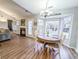 Dining area with a wooden table, white chairs, and a bay window overlooking the backyard at 308 Burton Ave, Summerville, SC 29485