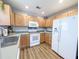 Charming kitchen featuring bright cabinets, stainless steel sink, and modern appliances at 308 Burton Ave, Summerville, SC 29485