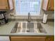 Close-up of the stainless steel kitchen sink with modern faucet and ample counter space at 308 Burton Ave, Summerville, SC 29485