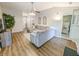 Bright living room features hardwood floors, modern decor, and a comfortable gray sectional at 308 Burton Ave, Summerville, SC 29485