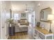 Inviting living room with a cozy sectional sofa and a fireplace, creating a warm atmosphere at 308 Burton Ave, Summerville, SC 29485