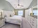 Bright main bedroom featuring carpet, high ceilings, fan, and large windows at 308 Burton Ave, Summerville, SC 29485