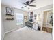 A well-lit home office features a desk, chair, ceiling fan, and decor at 308 Burton Ave, Summerville, SC 29485