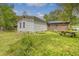 Backyard featuring well-maintained lawn and a quaint wooden picnic table near house at 3143 Bonanza Rd, Charleston, SC 29414