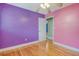 Bedroom featuring hardwood floors, and colored walls, offering a view into another room at 3143 Bonanza Rd, Charleston, SC 29414