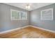 Bedroom with hardwood floors, gray walls and two windows providing natural light at 3143 Bonanza Rd, Charleston, SC 29414