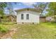 Exterior of a quaint home with a backyard view showing the vinyl siding and windows at 3143 Bonanza Rd, Charleston, SC 29414