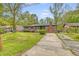 Charming single-story brick home with a well-manicured lawn and mature landscaping at 3143 Bonanza Rd, Charleston, SC 29414