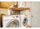 Image of laundry room featuring modern Samsung washer and dryer and hot water heater at 3143 Bonanza Rd, Charleston, SC 29414