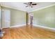 Spacious living room with hardwood flooring leads to a kitchen area at 3143 Bonanza Rd, Charleston, SC 29414