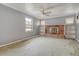 Living room with decorative brick fireplace and built-in shelving units at 3143 Bonanza Rd, Charleston, SC 29414