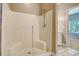 Image of white shower with shower head and built-in seating, looking into bedroom at 3143 Bonanza Rd, Charleston, SC 29414