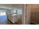 Open-concept kitchen with a kitchen island, stainless steel appliances, and durable wood floors at 315 Blue Haw Dr, Moncks Corner, SC 29461