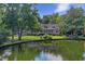 Charming home surrounded by mature trees and a tranquil lake at 3168 Stanyarne Dr, Charleston, SC 29414