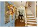 Grand foyer with beautiful staircase and a decorative front door at 3168 Stanyarne Dr, Charleston, SC 29414