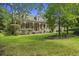Beautiful home with an inviting front porch and lush green lawn at 3168 Stanyarne Dr, Charleston, SC 29414