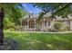 Charming home with a well-manicured lawn and a welcoming front porch at 3168 Stanyarne Dr, Charleston, SC 29414