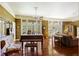 Spacious living room with hardwood floors, piano, ceiling fans, and ample natural light at 3168 Stanyarne Dr, Charleston, SC 29414